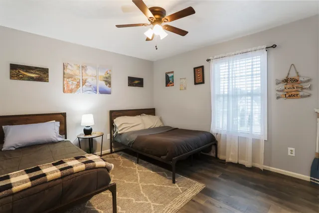 a bedroom with furniture and a window