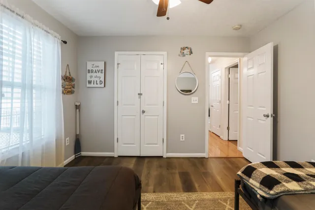 a bathroom with a sink vanity mirror and toilet