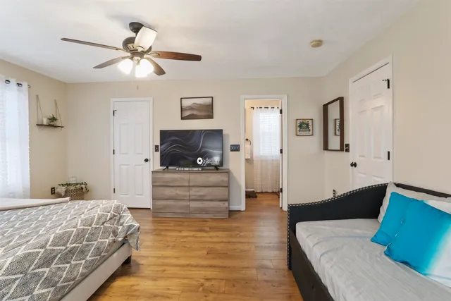 a bathroom with a sink vanity and mirror