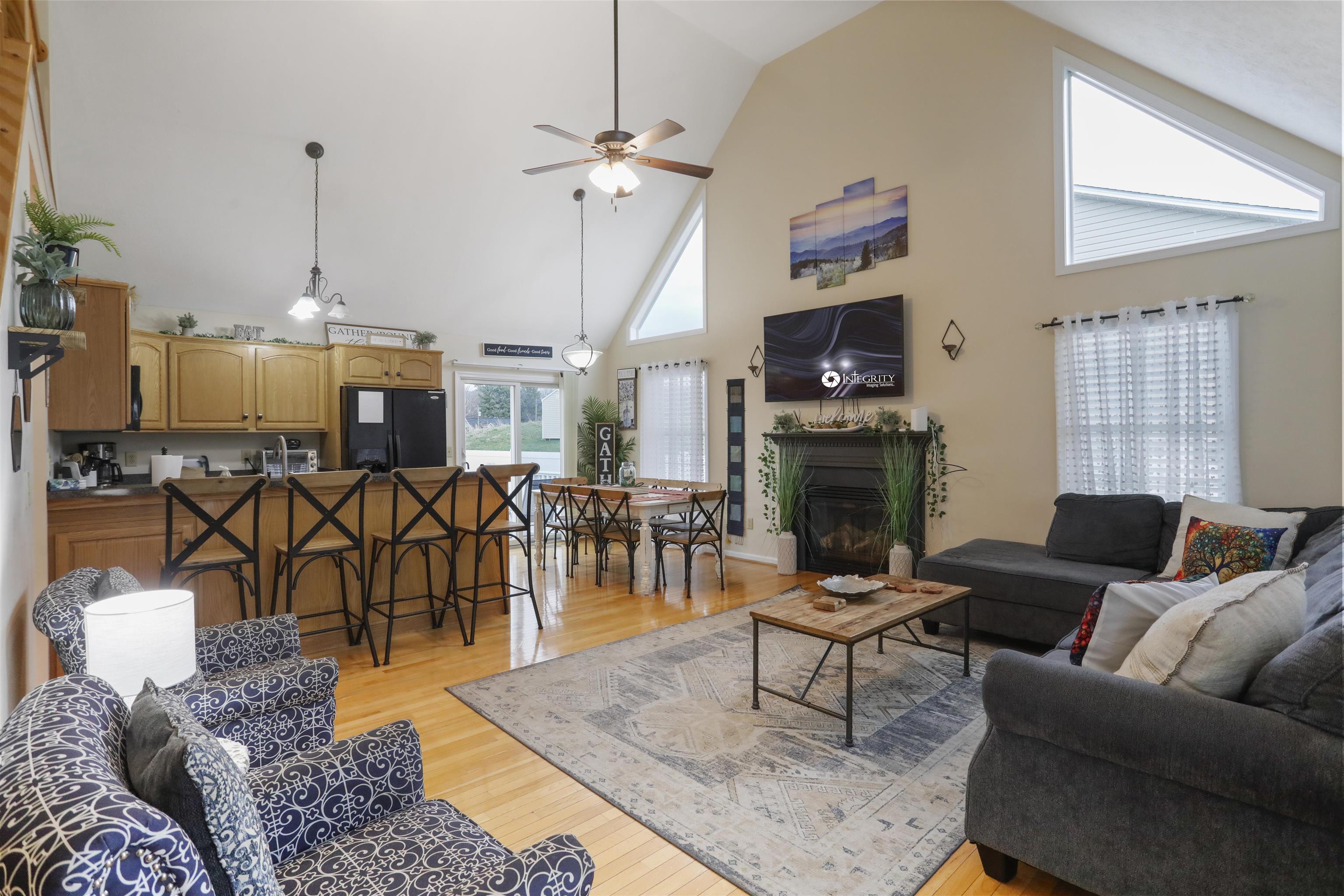 317 Locustdale Loop Shenandoah, VA 22849 - Photo 5 of 39 a living room with furniture a dining table and a fireplace