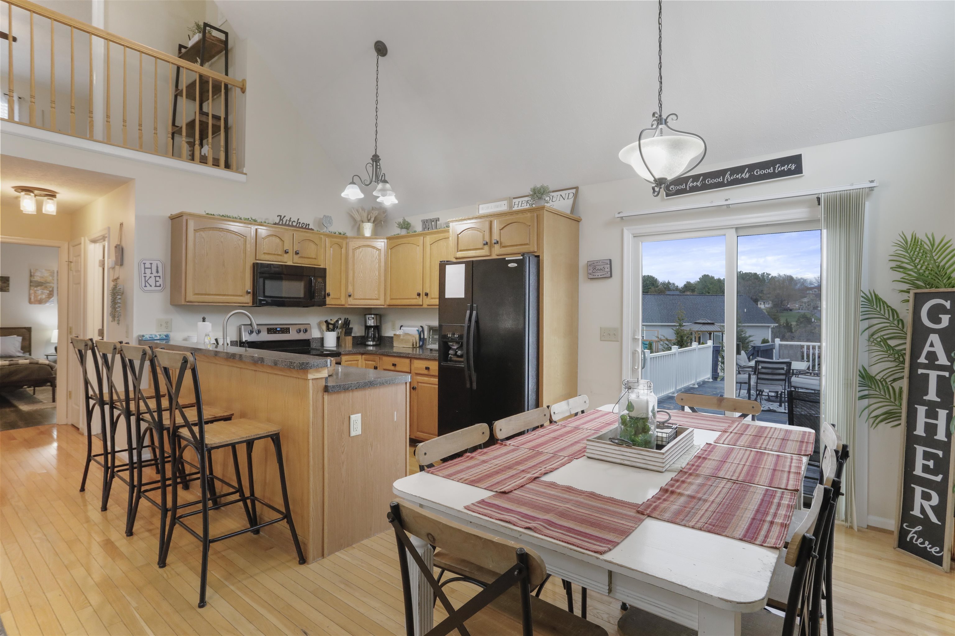 317 Locustdale Loop Shenandoah, VA 22849 - Photo 7 of 39 a kitchen with stainless steel appliances granite countertop a dining table chairs refrigerator and cabinets