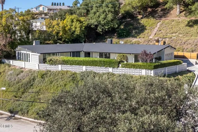 a view of house with outdoor space