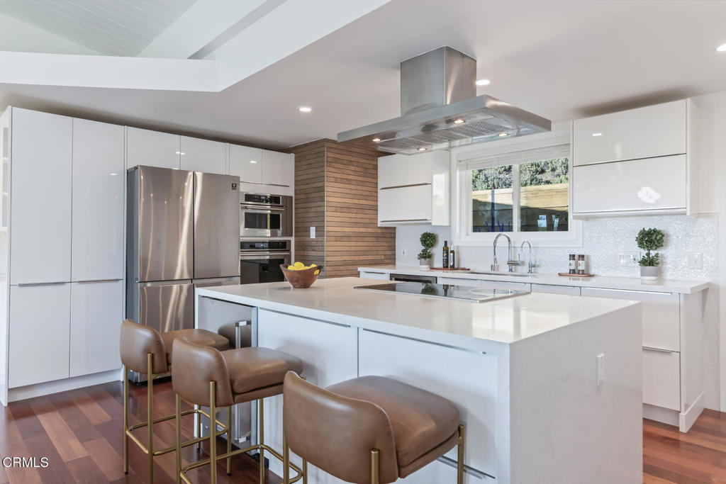 1823 Risa Place Glendale, CA 91208 - Photo 13 of 36 a kitchen with stainless steel appliances a sink stove and refrigerator