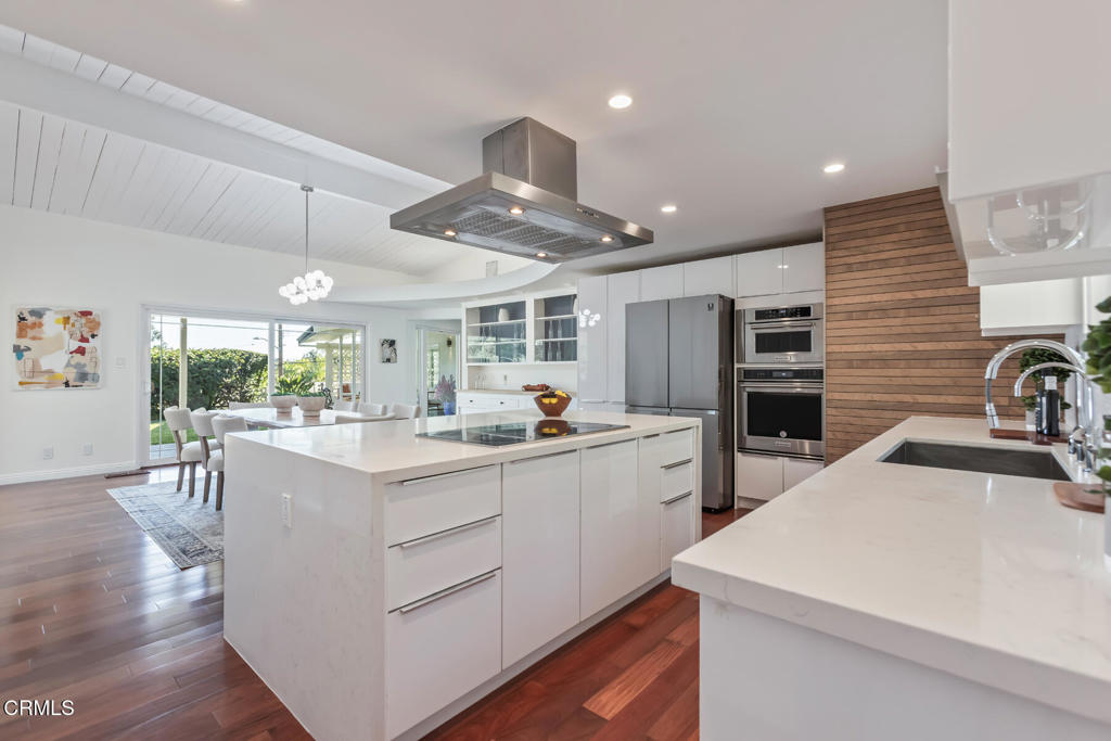 1823 Risa Place Glendale, CA 91208 - Photo 15 of 36 a kitchen with stainless steel appliances kitchen island granite countertop a sink and cabinets