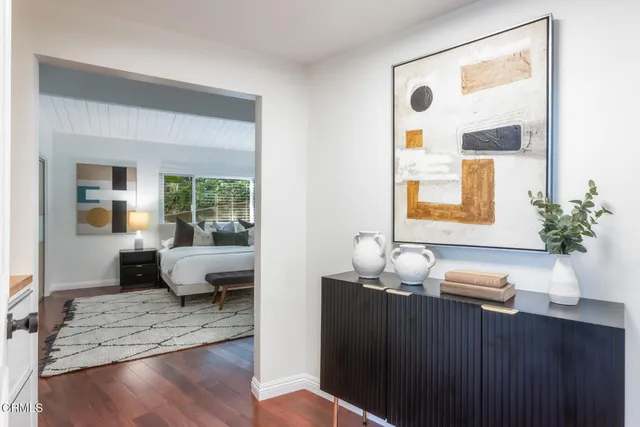 a living room with furniture and large window