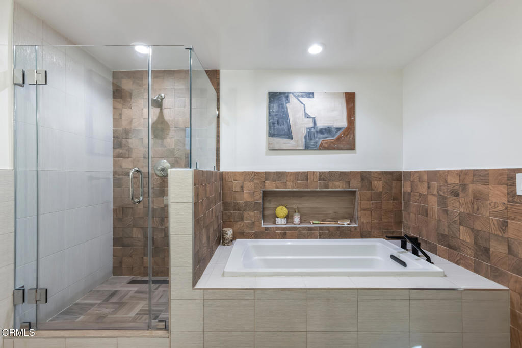 1823 Risa Place Glendale, CA 91208 - Photo 20 of 36 a bathroom with a tub a shower and view