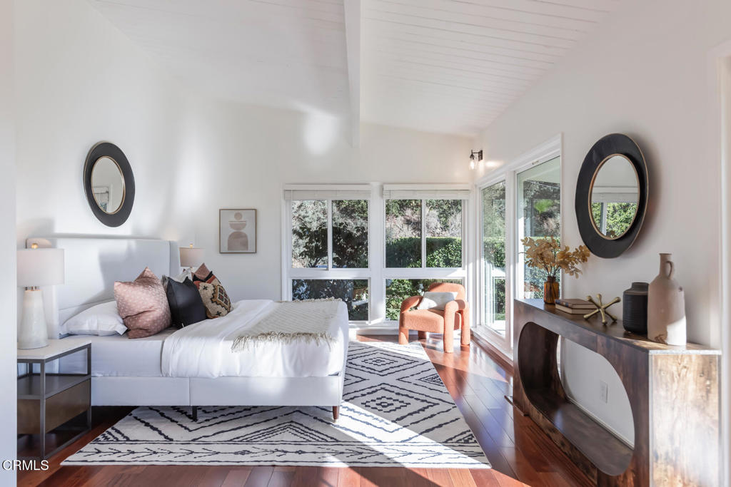 1823 Risa Place Glendale, CA 91208 - Photo 22 of 36 a living room with furniture a clock and a large window