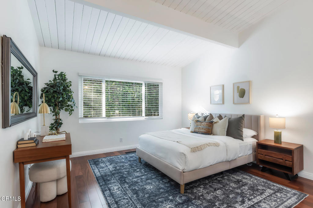 1823 Risa Place Glendale, CA 91208 - Photo 23 of 36 a bedroom with a bed and wooden floor