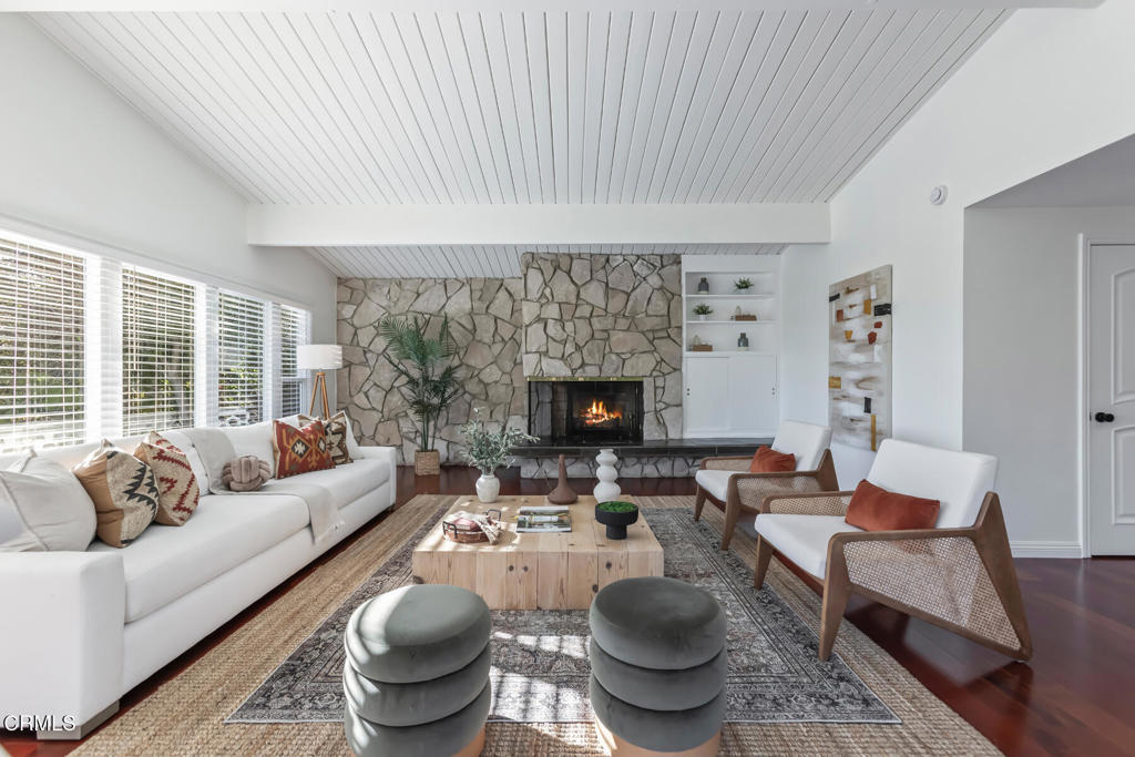 1823 Risa Place Glendale, CA 91208 - Photo 7 of 36 a living room with furniture a rug and a fireplace