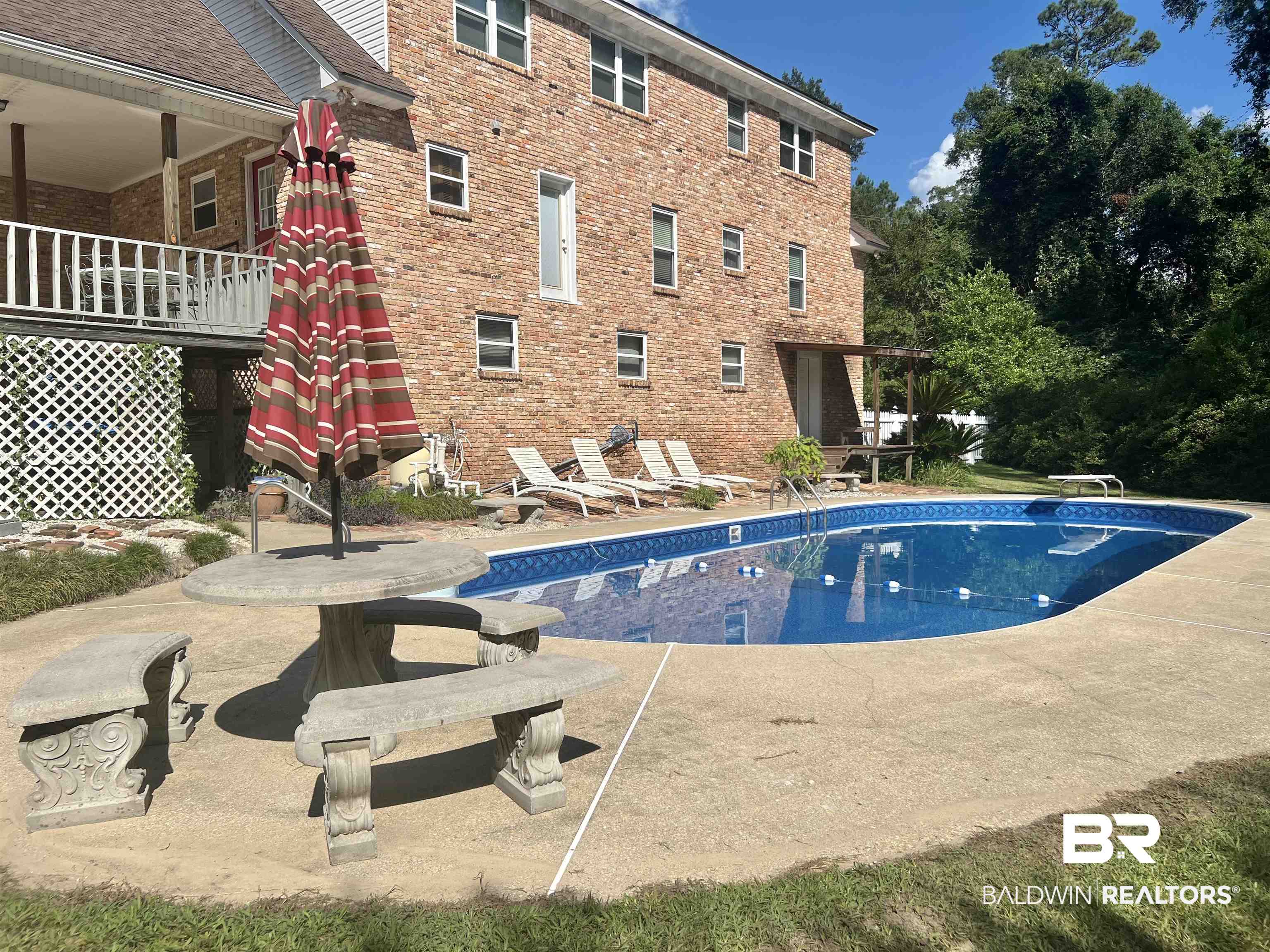 2691 Appleton Road Brewton, AL 36426 - Photo 46 of 60 Swimming pool with a patio area and a diving board