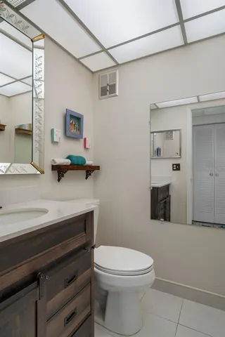 a bedroom with a bed and a dresser in it