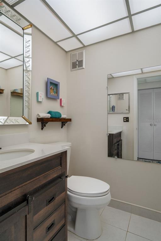11630 Bayonet Lane New Port Richey, FL 34654 - Photo 16 of 58 a bathroom with a sink a toilet and mirror