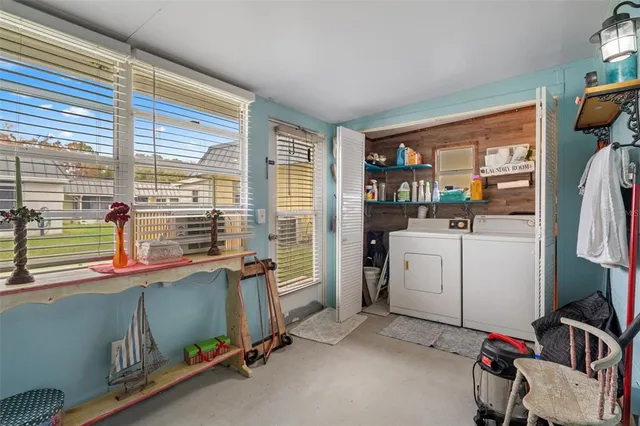 a view of a house with backyard and porch