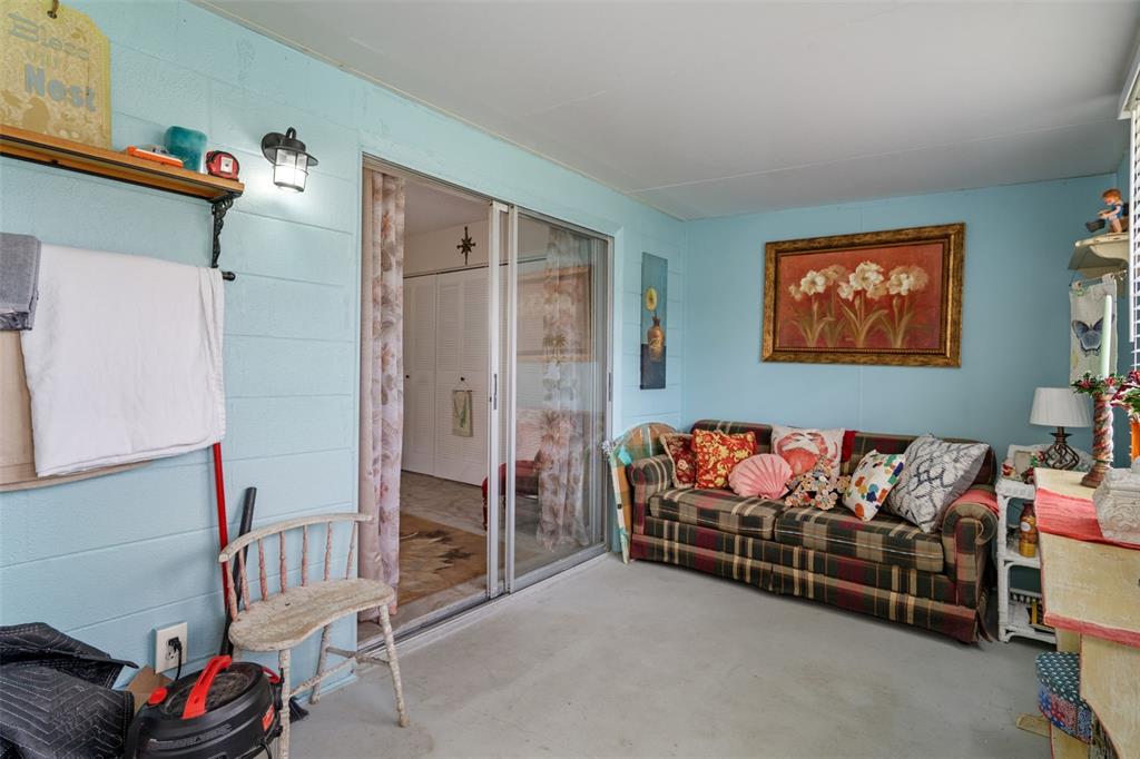 11630 Bayonet Lane New Port Richey, FL 34654 - Photo 25 of 58 a living room with furniture and a baby crib