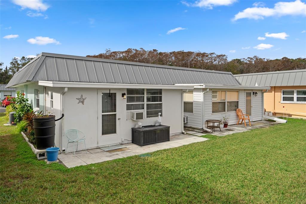 11630 Bayonet Lane New Port Richey, FL 34654 - Photo 26 of 58 a front view of a house with patio