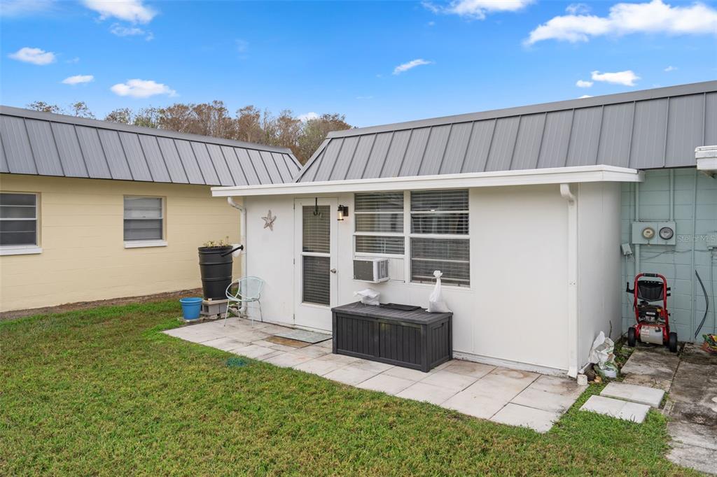 11630 Bayonet Lane New Port Richey, FL 34654 - Photo 27 of 58 a view of a house with backyard and porch