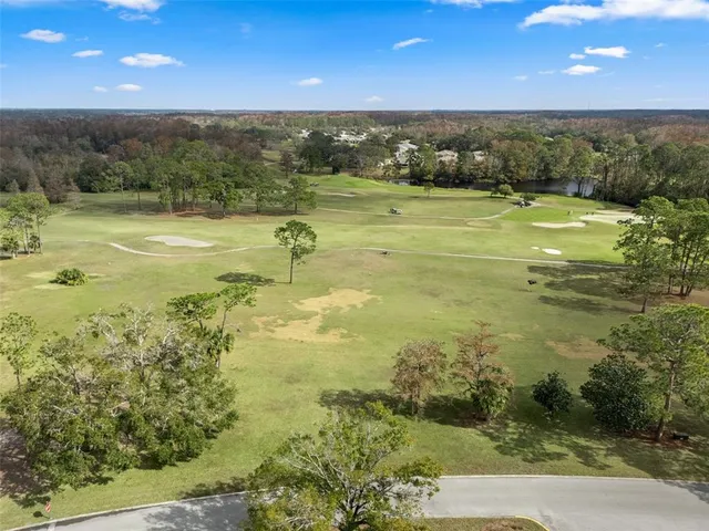 a living room with lots of furniture and a large window