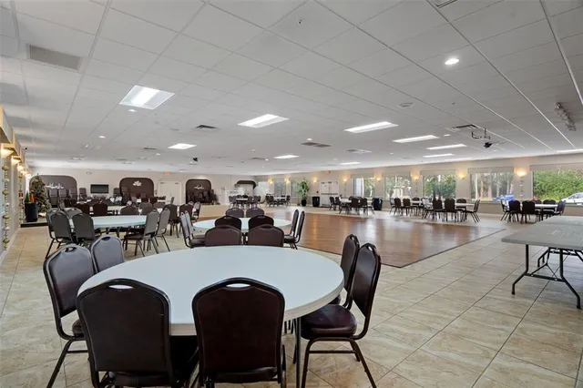 a view of a swimming pool and trees in the background