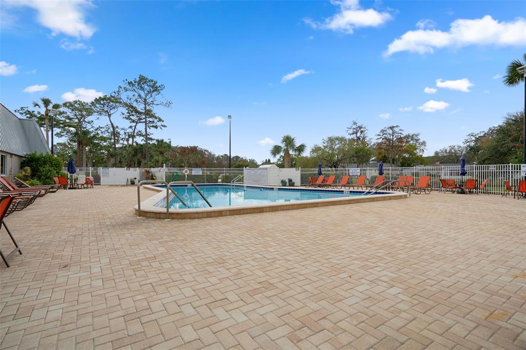 11630 Bayonet Lane New Port Richey, FL 34654 - Photo 43 of 58 a view of swimming pool with outdoor seating