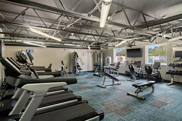 a lobby with furniture and flowers