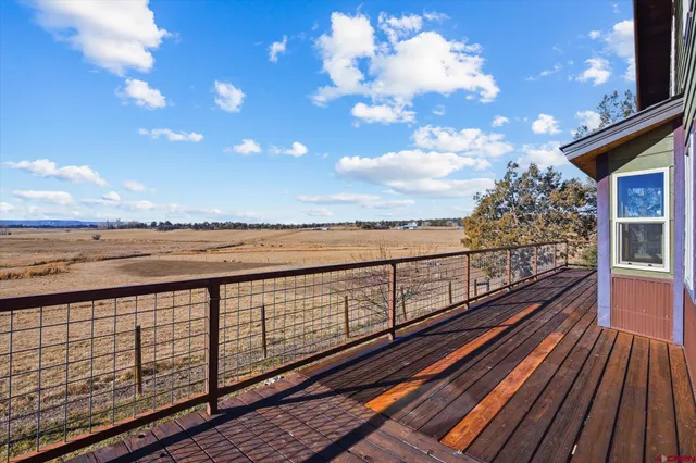 a backyard view of a house with entertaining space