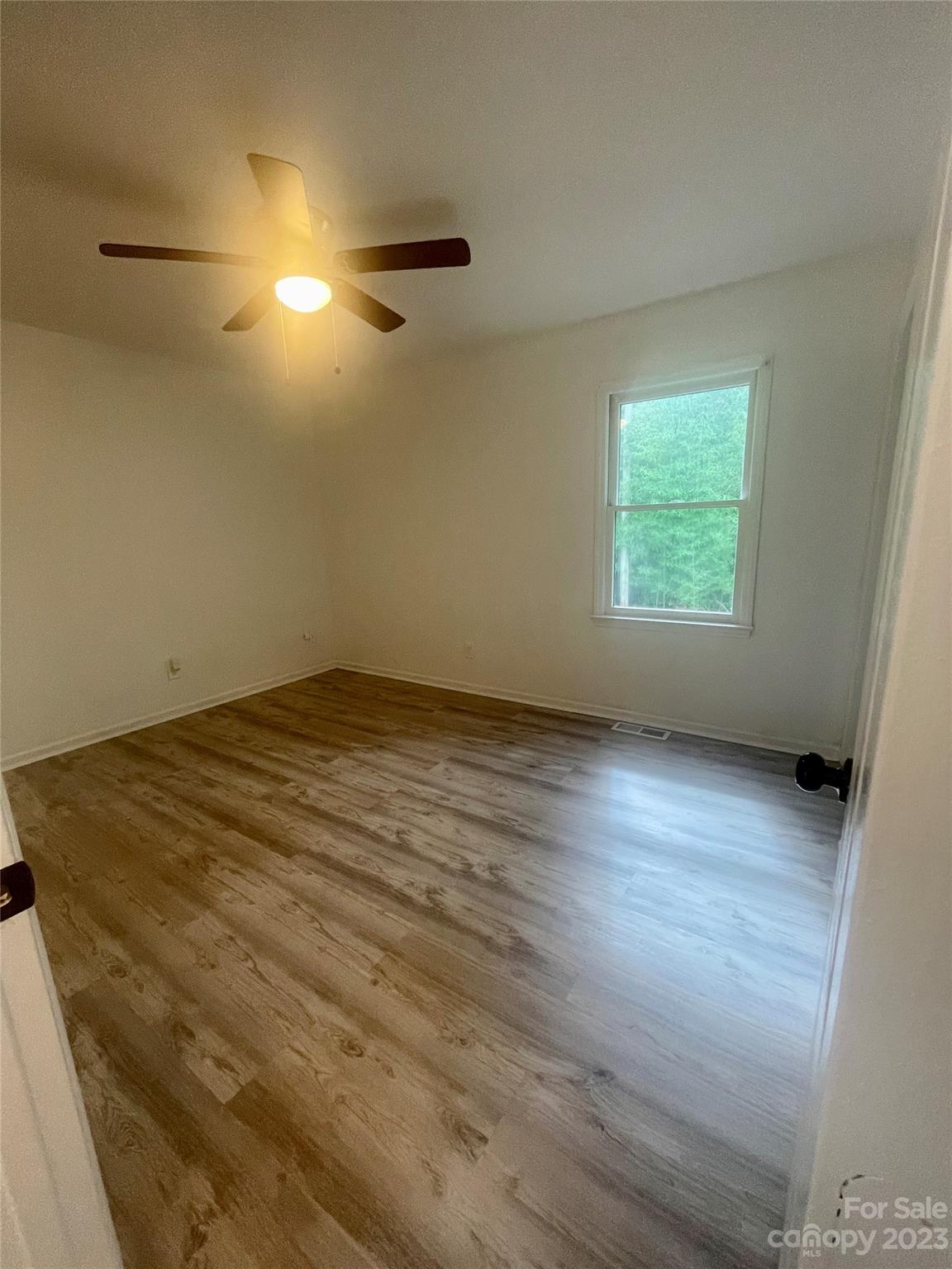 326 Finley Square Rock Hill, SC 29730 - Photo 13 of 15 an empty room with wooden floor and windows