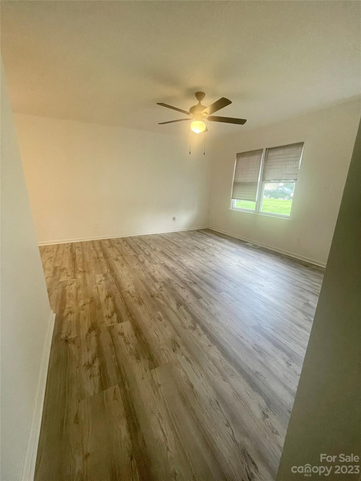 326 Finley Square Rock Hill, SC 29730 - Photo 3 of 15 an empty room with a empty space and a ceiling fan