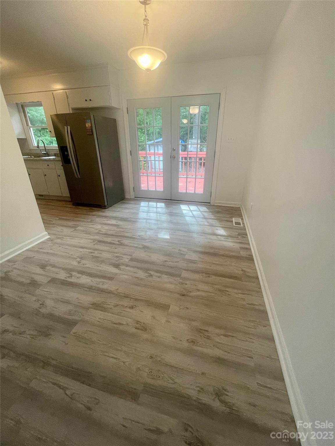326 Finley Square Rock Hill, SC 29730 - Photo 4 of 15 a view of an empty room with wooden floor and windows