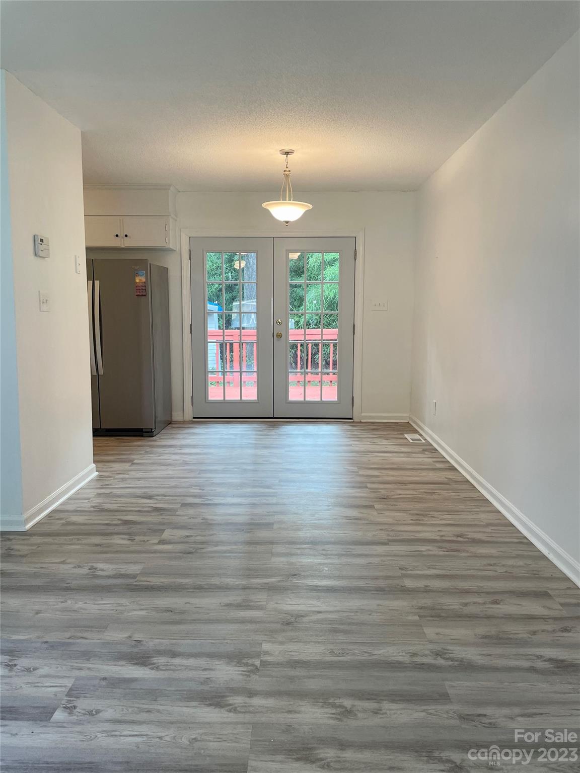 326 Finley Square Rock Hill, SC 29730 - Photo 5 of 15 a view of an empty room with wooden floor and a window