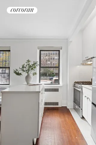 a view of a dining room with furniture and window