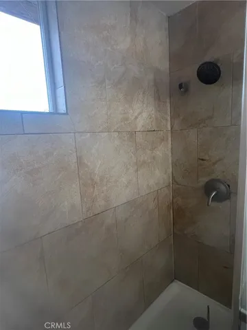 a large kitchen with cabinets and stainless steel appliances