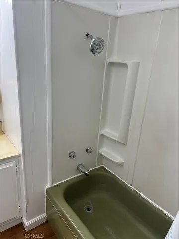 a bathroom with a sink and shower