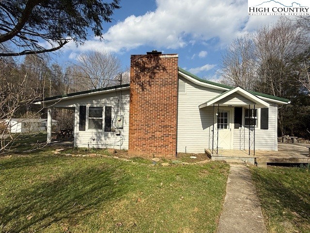 304 Elk River Road Elk Park, NC 28622 - Photo 2 of 36 a front view of a house with a yard