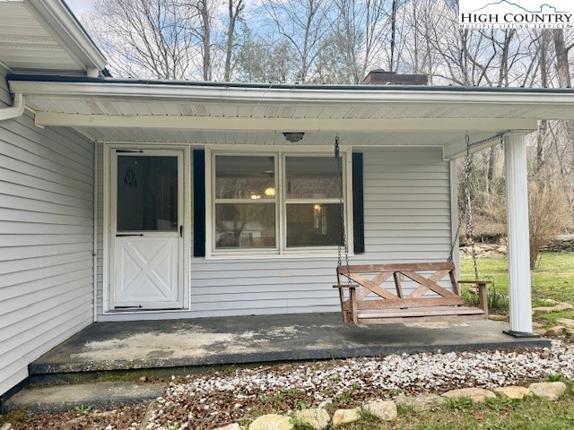 304 Elk River Road Elk Park, NC 28622 - Photo 25 of 36 a view of a house with a window and sitting area