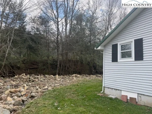 a backyard of a house with lots of green space