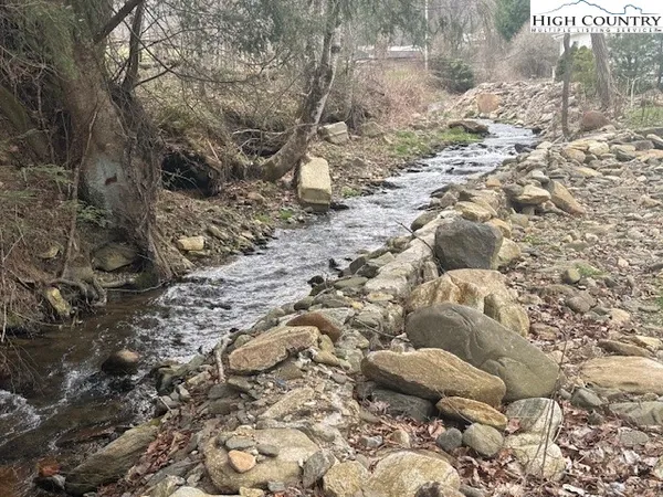 a view of a yard covered with snow in the background