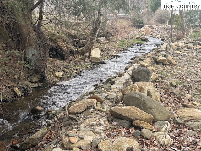 304 Elk River Road Elk Park, NC 28622 - Photo 28 of 36 a view of a yard covered with snow in the background