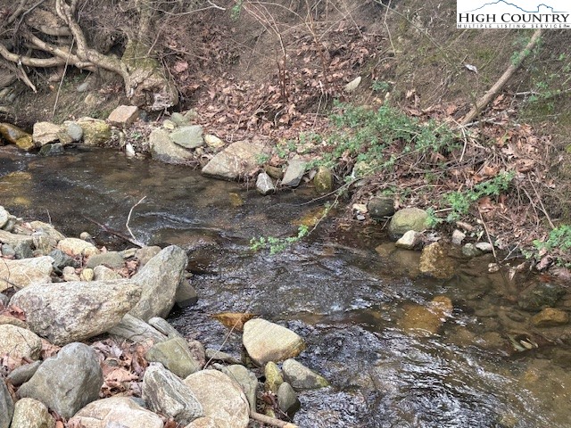 304 Elk River Road Elk Park, NC 28622 - Photo 29 of 36 a backyard of a house with lots of green space