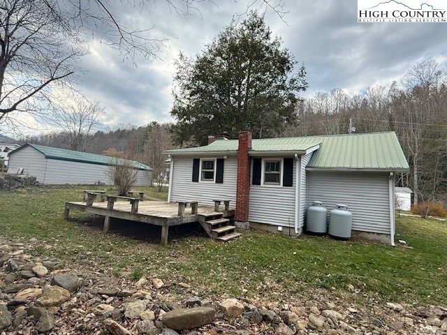 304 Elk River Road Elk Park, NC 28622 - Photo 31 of 36 a view of a house with back yard