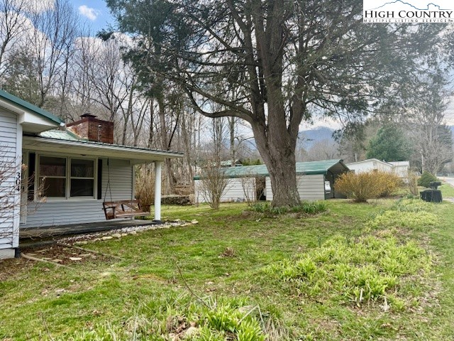 304 Elk River Road Elk Park, NC 28622 - Photo 4 of 36 a front view of a house with a yard