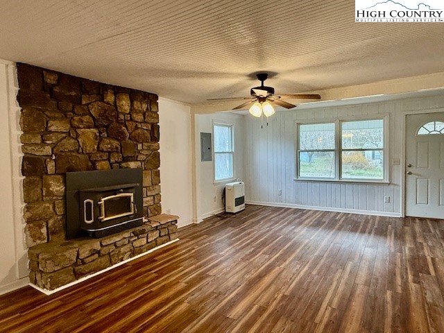 304 Elk River Road Elk Park, NC 28622 - Photo 10 of 36 a view of an empty room with wooden floor fireplace and a window