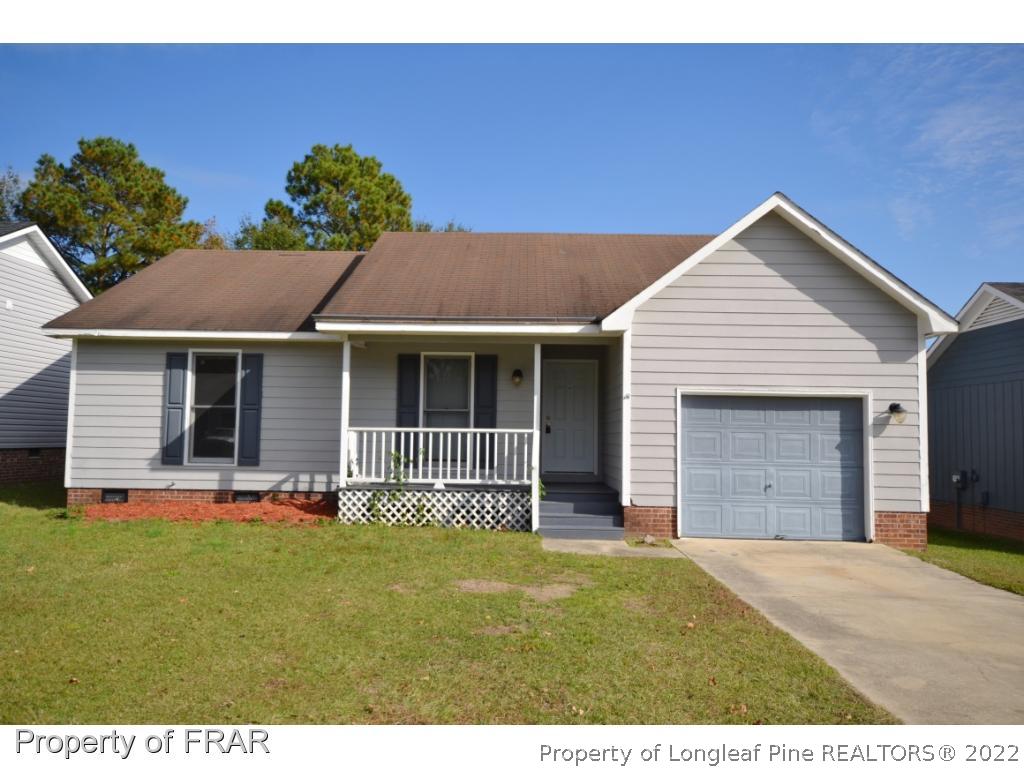 612 Jennings Farm Road Fayetteville, NC 28314 - Photo 1 of 27 a front view of a house with a garden and yard