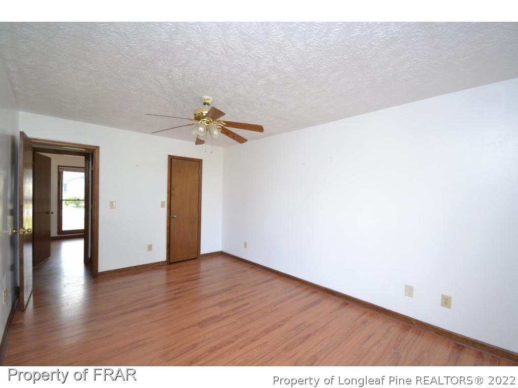 612 Jennings Farm Road Fayetteville, NC 28314 - Photo 16 of 27 a view of an empty room with wooden floor