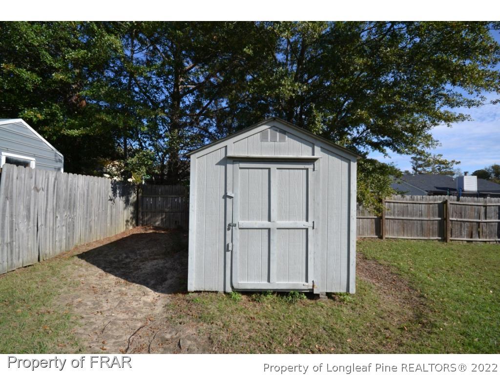 612 Jennings Farm Road Fayetteville, NC 28314 - Photo 24 of 27 a backyard of a house with lots of green space
