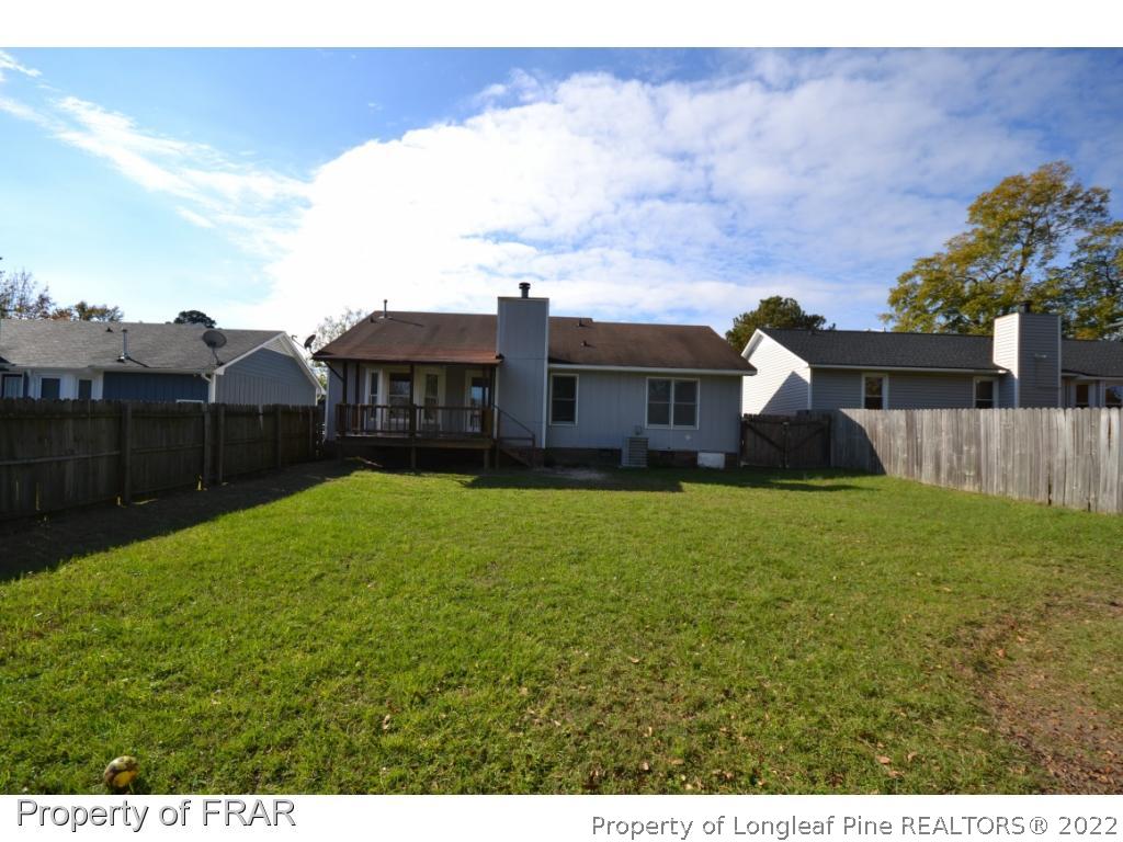 612 Jennings Farm Road Fayetteville, NC 28314 - Photo 26 of 27 a view of a house with a yard and sitting area