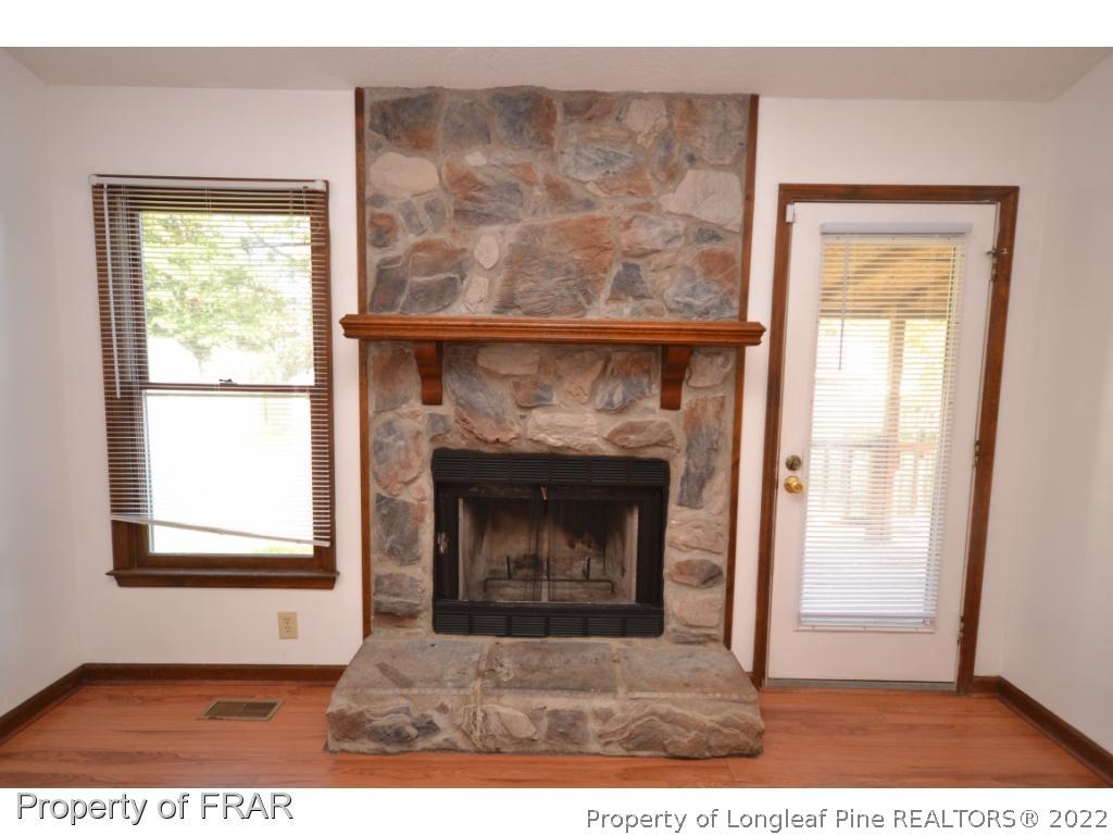 612 Jennings Farm Road Fayetteville, NC 28314 - Photo 4 of 27 a black and white building with a fireplace