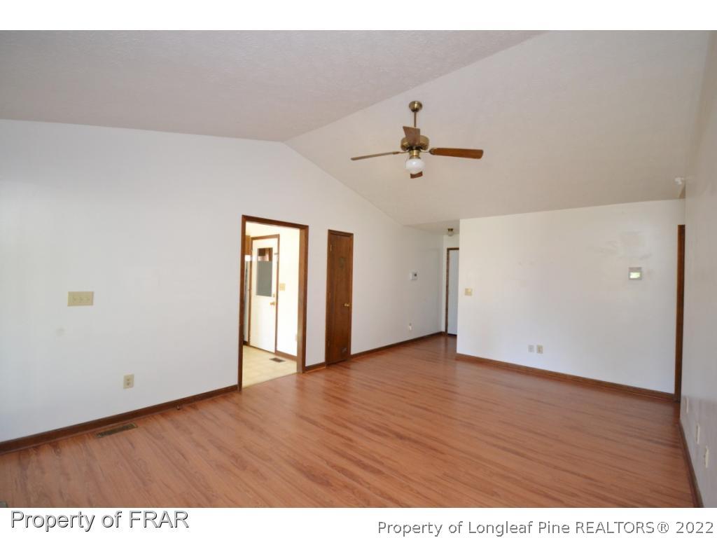612 Jennings Farm Road Fayetteville, NC 28314 - Photo 5 of 27 a view of an empty room with wooden floor