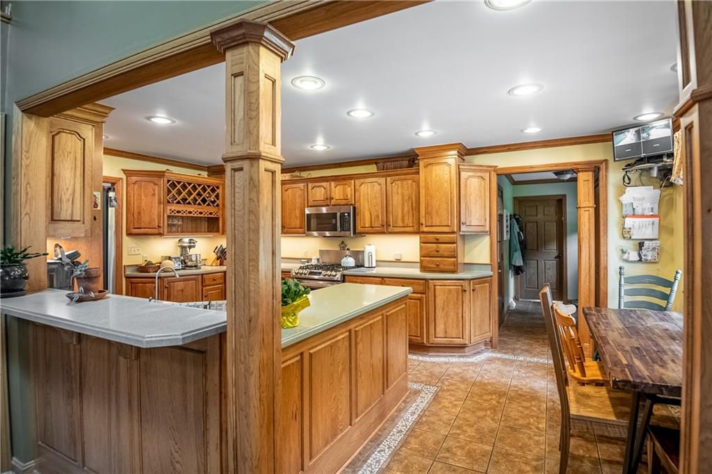 289 Nutt Road Grove City, PA 16127 - Photo 12 of 25 a kitchen with a sink appliances cabinets and furniture