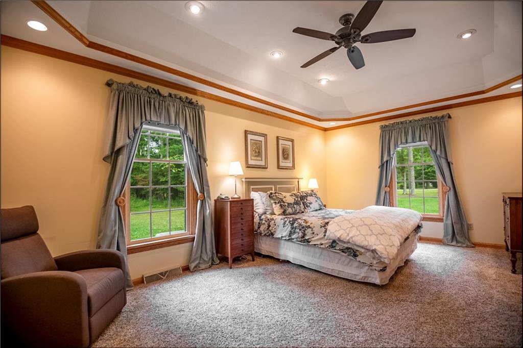 289 Nutt Road Grove City, PA 16127 - Photo 15 of 25 a bedroom with bed couch and window