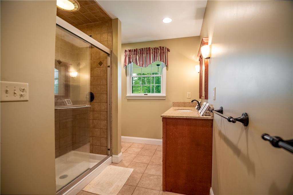 289 Nutt Road Grove City, PA 16127 - Photo 20 of 25 a bathroom with a tub shower and sink